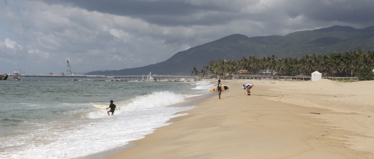 A school of local children prepare for a surf lesson