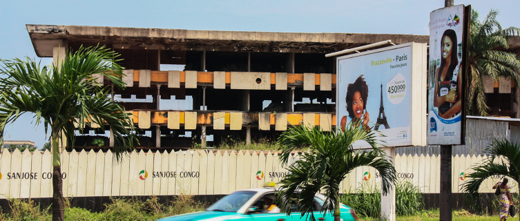 Driving past a shell of a building bombed during the war