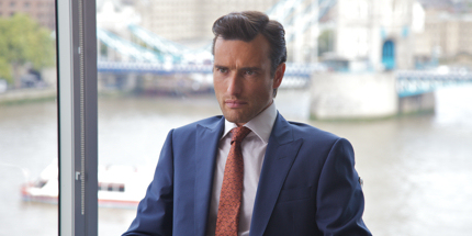 Ed swaps period costumes for slick suits in Papadopoulos & Sons