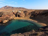 Explore the golden sands of Papagayo Beach