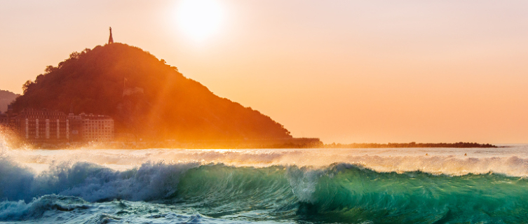 The sun sets over the beach at San Sebastián in Spain