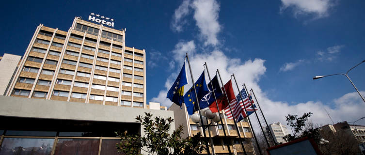 Flags outside Pristina's famous Grand Hotel
